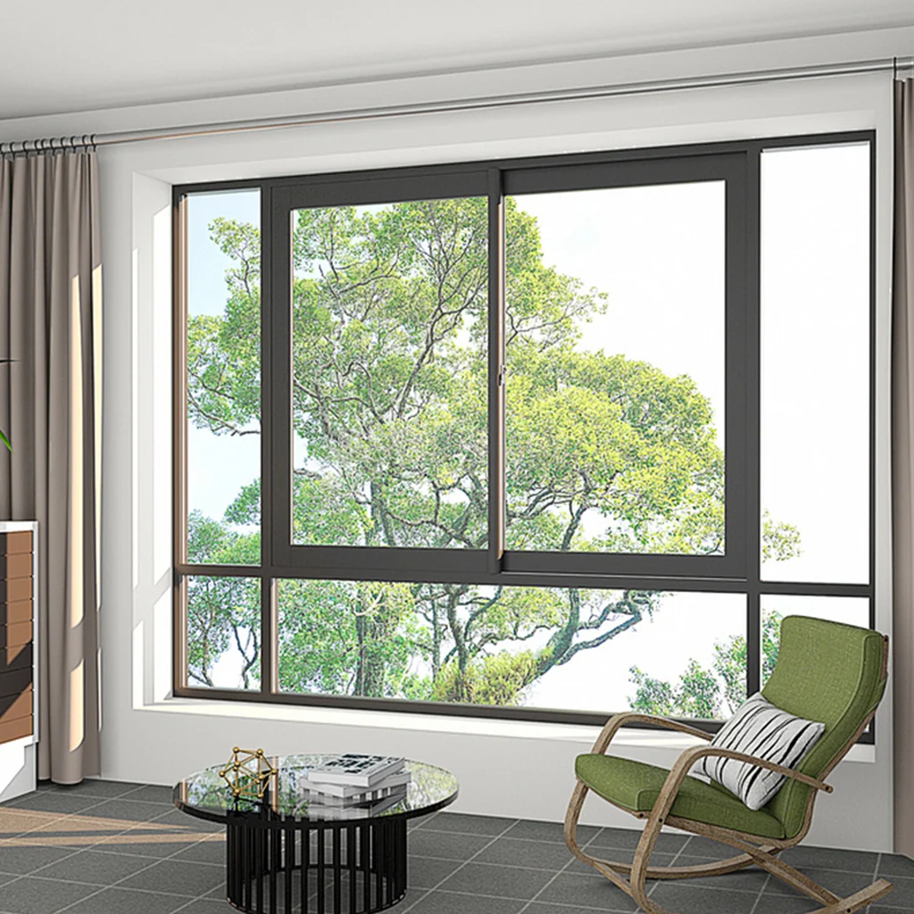 Aluminum sliding window with horizontal track operation in modern living room, thermal break black frame with green tree view, space-saving design for residential projects — Starveil Build