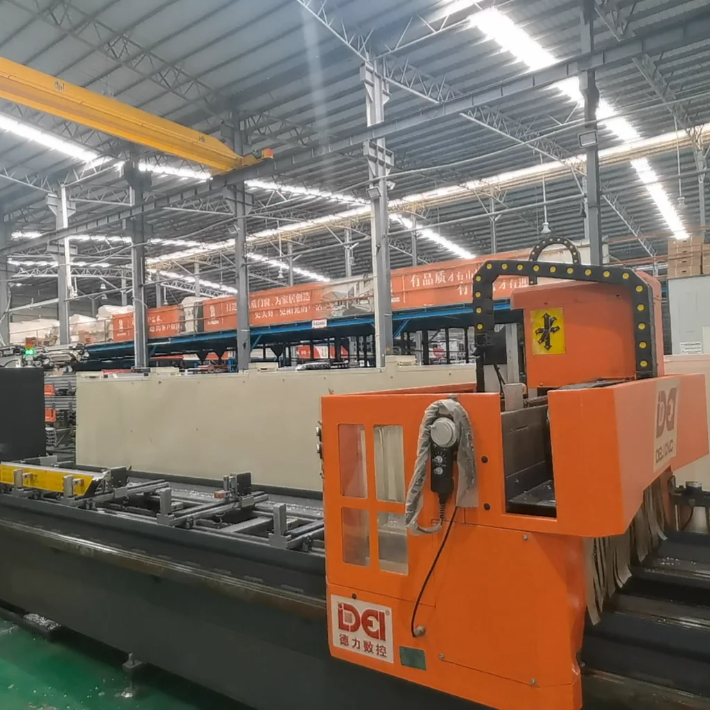 CNC machining center cutting aluminum profiles for window and door frames