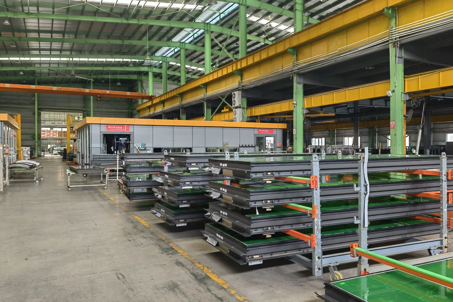 StarveilBuild aluminum window and door factory assembly with dark frames on production racks, OEM factory Foshan